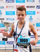 Max Pearson (Tynedale) winner of the 13-14 years BUPA Junior Great Run with his charity number.